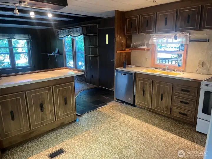 Looking from eating area to kitchen and living area.