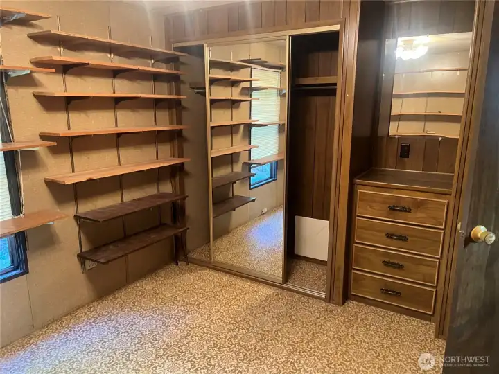 Second bedroom closet and built in dresser.