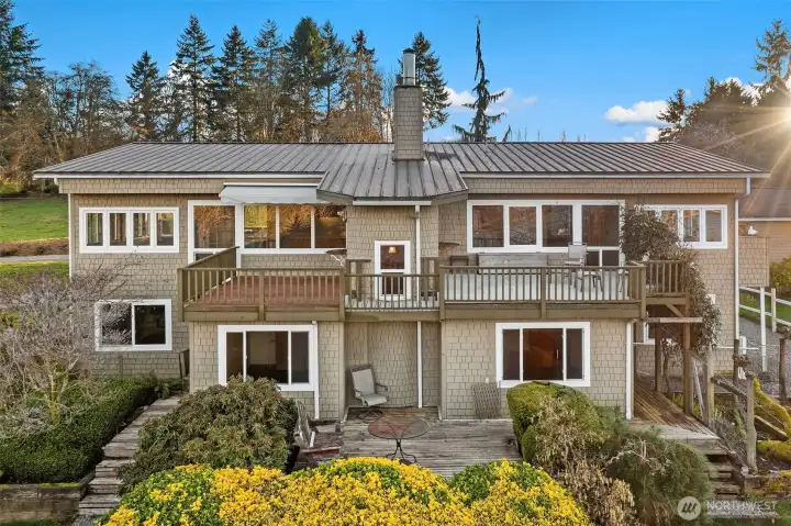 Perfectly perched two-story home in Dockton — a dynamic neighborhood close to waterfront, trails and a waterfront park.