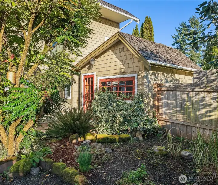 Adorable cottage-inspired garden shed full of charm and character.