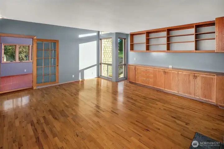 Living area w/ hardwood floors and lots of storage space.