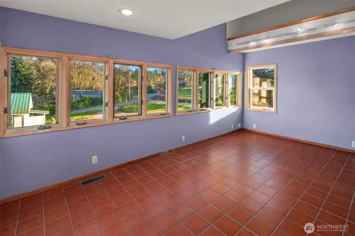 Bright and cheerful craft room with plenty of natural light.