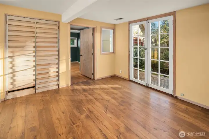 Lower level living room leads to private garden.