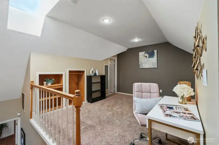 The open loft adds flexible living space and could easily be enclosed as a private fourth bedroom or guest suite—ideal for extended living, multigenerational use, or a quiet work-from-home retreat.