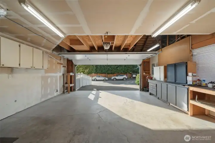 Large 2 car garage offering great additional storage above in the attic. The  garage door is newer.