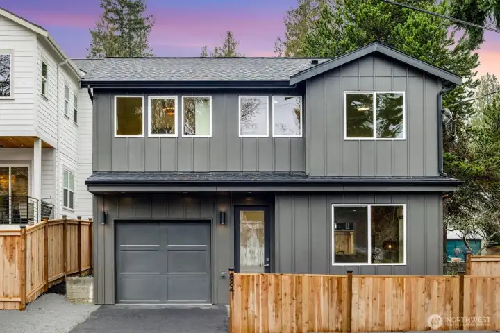 This detached cottage fronts Earl Ave NW and has ample parking.