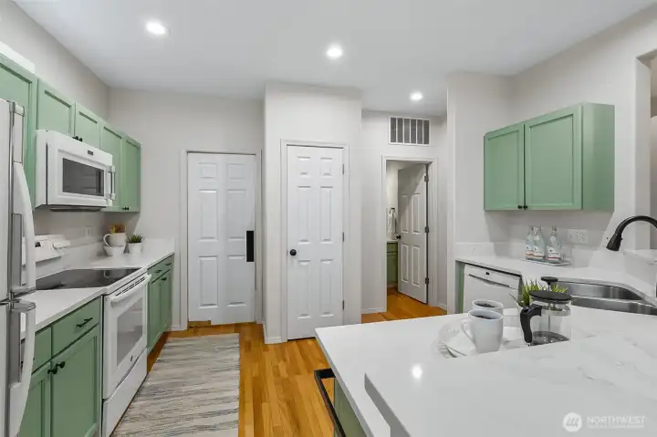 kitchen with door to laudry, pantry and 1/2bathroom