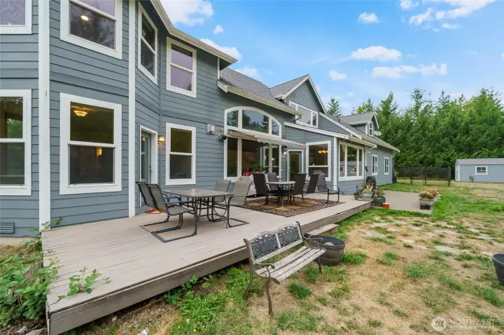Relax on the back deck while enjoying the natural, tranquil scenery.