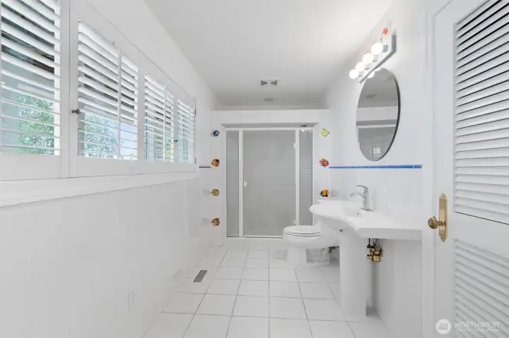 Large bathroom with a shower serving the lower floor.