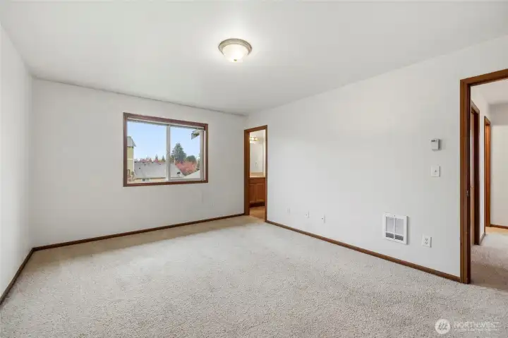 Primary bedroom looks to the south. Attached bathroom and huge walkin closet