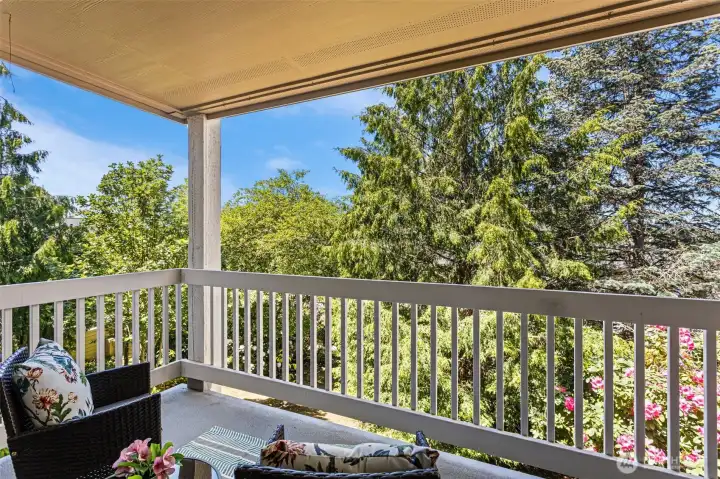 A covered deck for year round enjoyment. Enjoy the colorful flowers in the common area garden and the sunsets facing west toward Seattle!