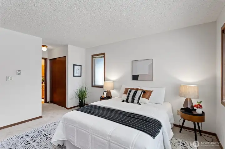 Double closets conveniently located between the bedroom and bathroom.