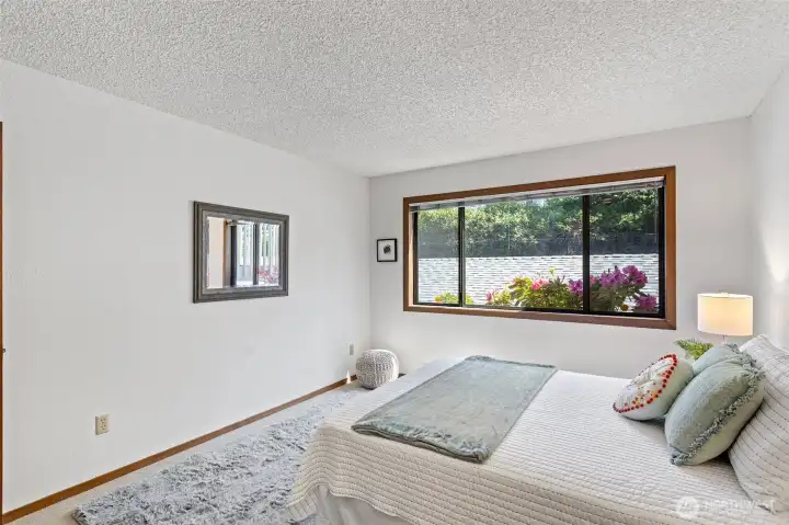 This 2nd bedroom has extra space for seating, a desk, drawers or even sharing with your sibling.