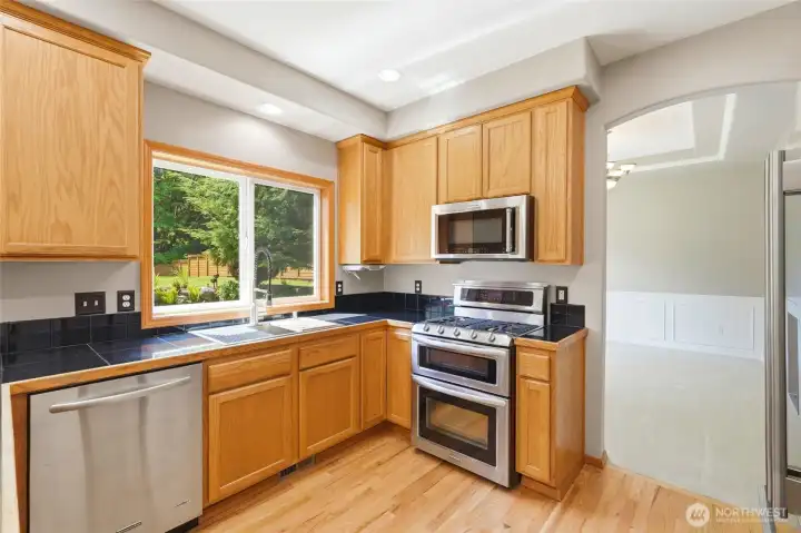 Granite countertops and stainless steel appliances.