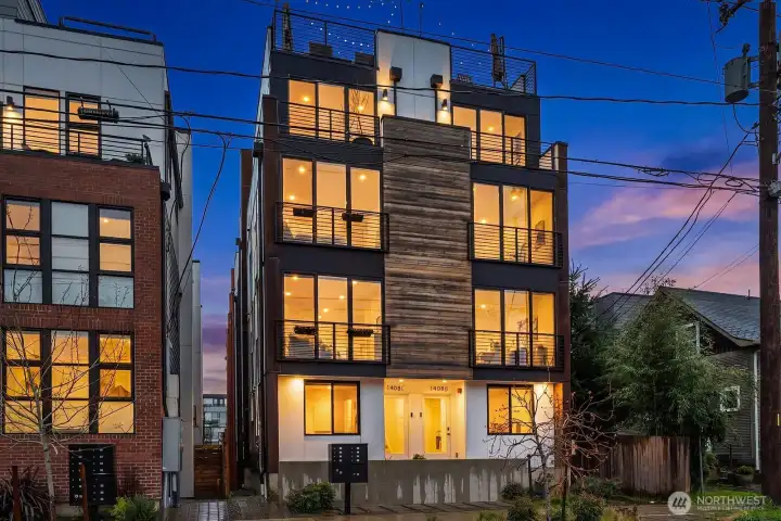 Striking modern end-unit townhome with dramatic floor-to-ceiling windows, bold contemporary architecture, and an unbeatable location perfectly positioned between Capitol Hill and the Central District.