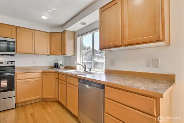 New dishwasher. Sink area with Large windows to look out cozy backyard