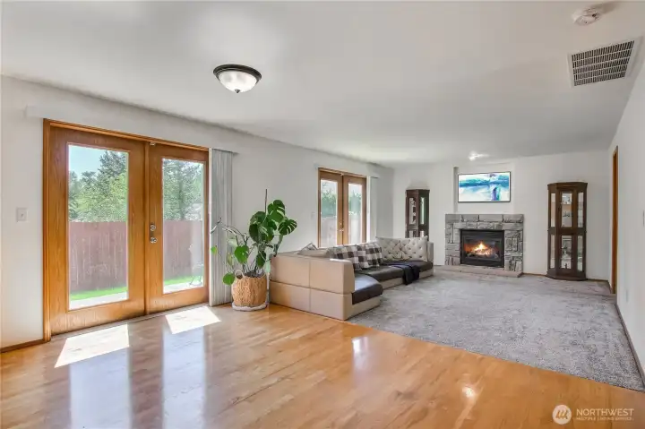 Beautiful hardwood floorings in Nook. open to family room that has cozy gas fireplace - virtually staged