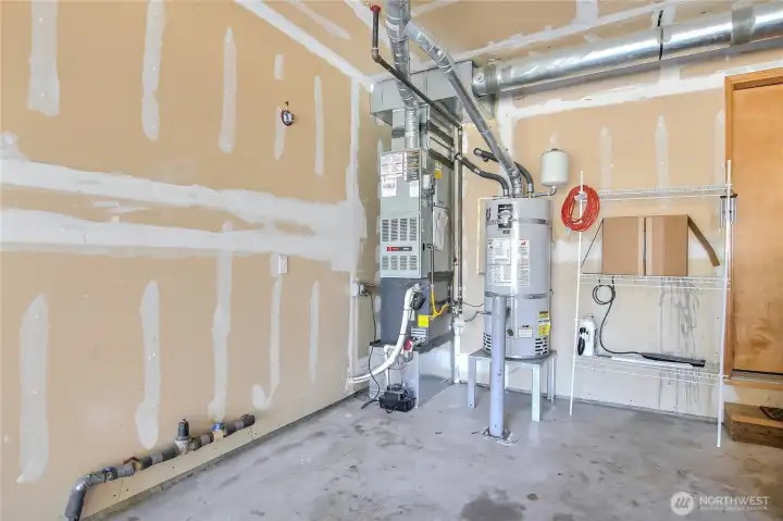 Garage view - newer furnace and New water heater on 5/12/2026