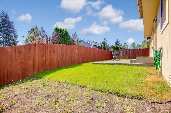 Backyard has gardening area
