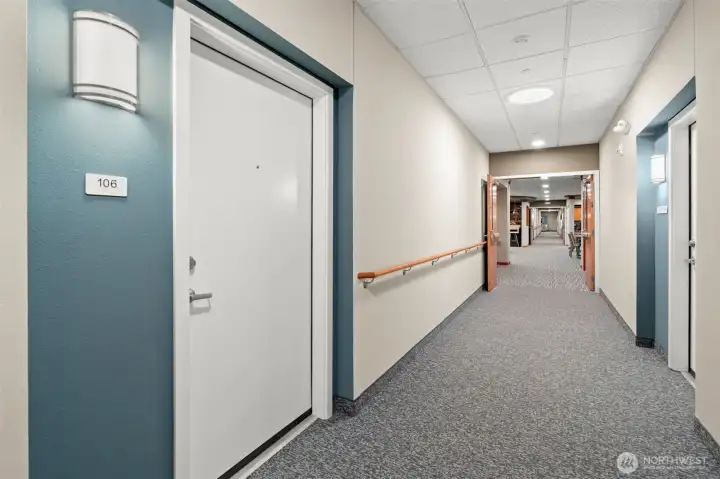 Interior hallway and door to unit