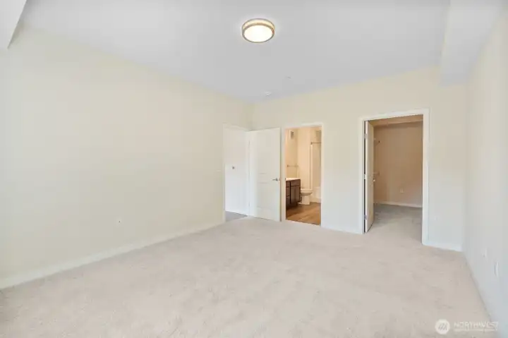 Master suite with attached bathroom and large walk in closet