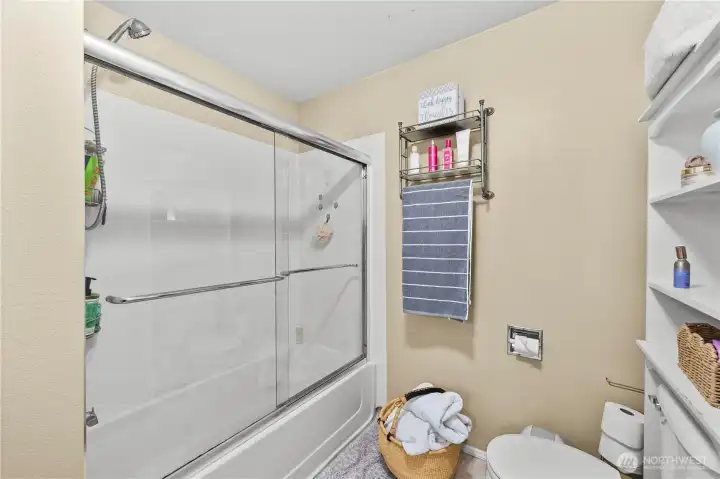 Bathroom with tub and shower