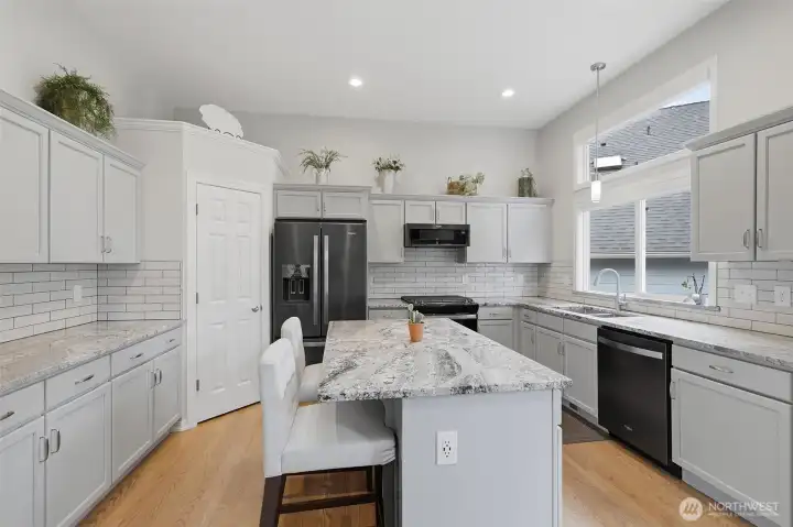 Updated kitchen showcases granite countertops, stainless steel appliances, abundant cabinetry, and modern finishes designed for both everyday living and entertaining. Updated kitchen showcases granite countertops, stainless steel appliances, abundant cabinetry, and modern finishes designed for both everyday living and entertaining.