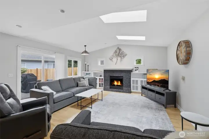 Fully permitted family room addition features vaulted ceiling, gas fireplace, built-in cabinets, skylights and sliding glass door to patio. Everyone wants a room like this - useful and beautiful! Fully permitted family room addition features vaulted ceiling, gas fireplace, built-in cabinets, skylights and sliding glass door to patio. Everyone wants a room like this - useful and beautiful!