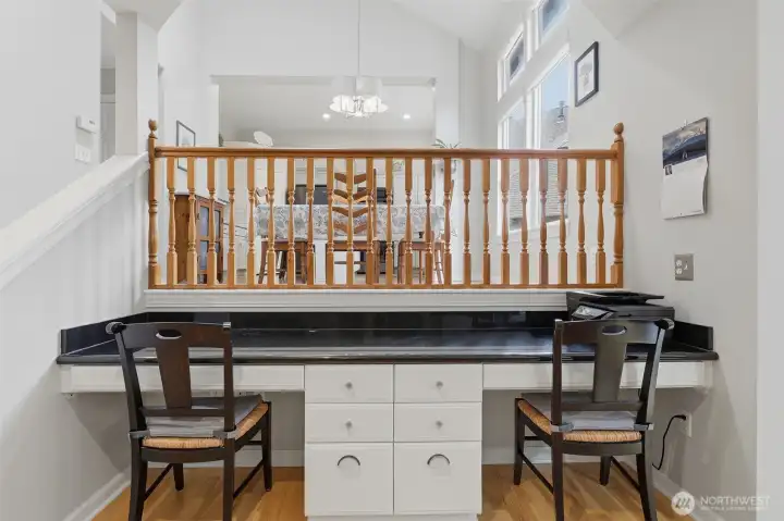 Built-in desks in family room with granite countertop. Built-in desks in family room with granite countertop.