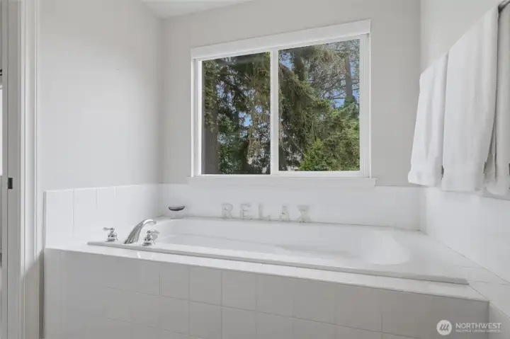 Soaking tub in primary bathroom. Soaking tub in primary bathroom.