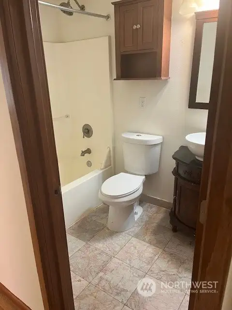 The full bathroom used by company and the bedroom that does not have a bathroom connected to it.