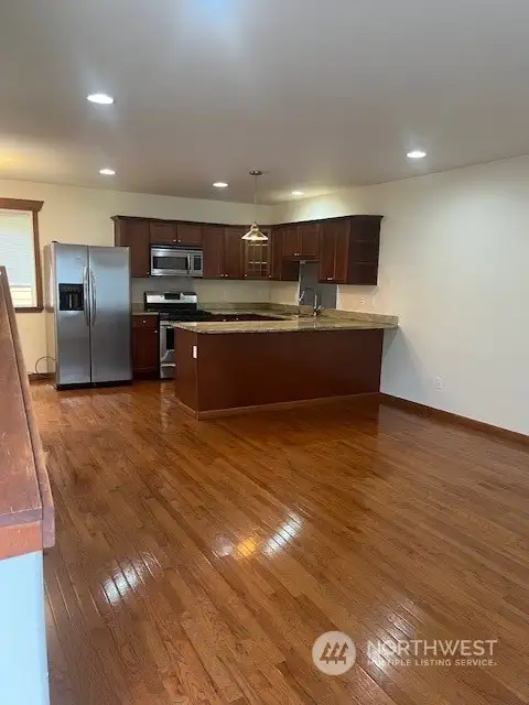 Wow! real wood floors! not that fake stuff with this home! The view is as you walk into the home.