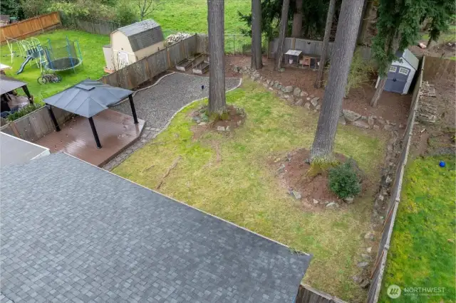 Raised garden beds, chicken coop, and garden shed.