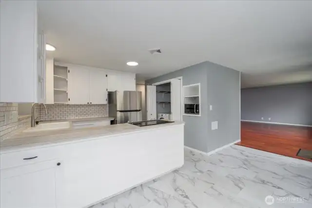 Spacious kitchen flows into the living room.