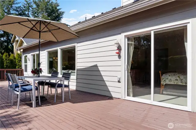 Another view of spacious deck with sliding doors from primary bedroom