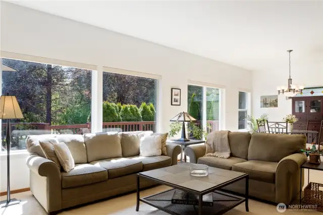 Living area is lined with a wall of windows