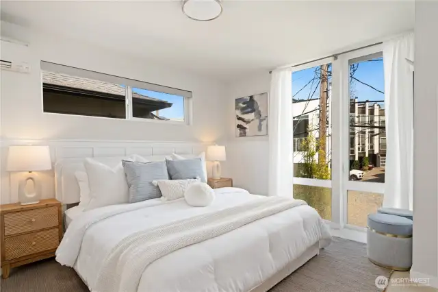 Primary bedroom located on top floor with custom wainscoting and adjoining ensuite bath