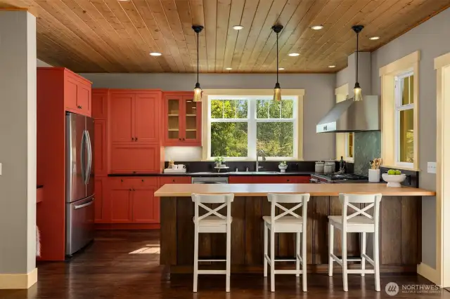 Inspired kitchen with peninsula seating and desk "nook"