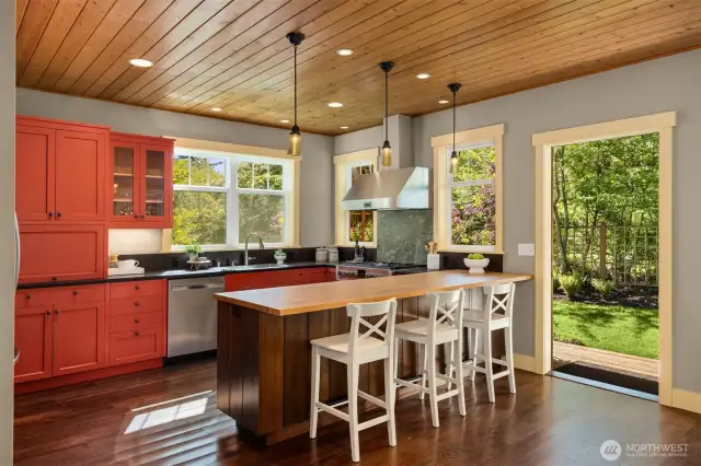 The kitchen door opens to a sweet yard...