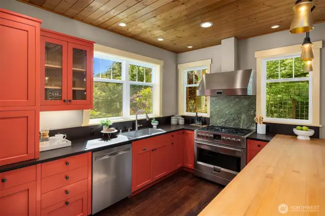 Featuring durable PaperStone countertops and a large butcher block peninsula