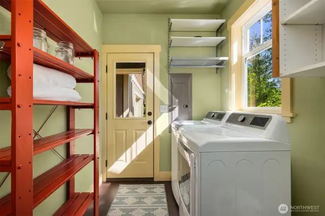 The laundry room door provides access to the detached garage