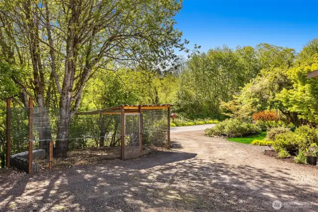 A large, fenced enclosure awaits your chickens