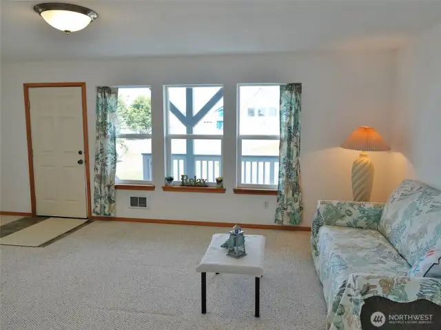 Enter from the Front Deck into the Living Room.