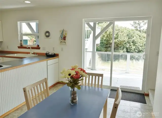 Dining Room w/ a slider to the Rear Deck.  (Stairs to the 2nd and 3rd levels are on the right.)