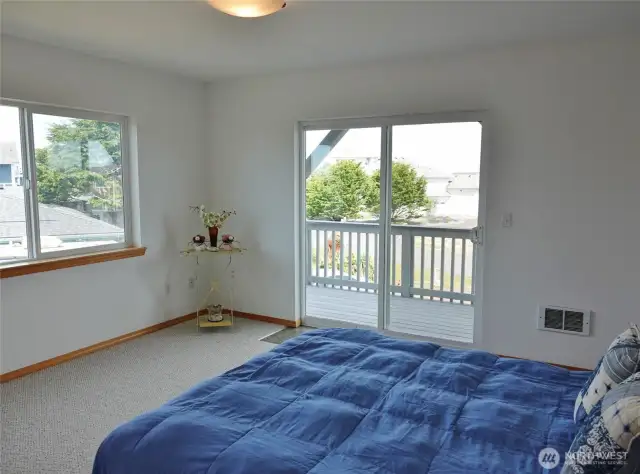 2nd-level Master Bedroom.  Spacious room w/ lots of natural light and a slider to the Front Deck. Some Ocean Views.