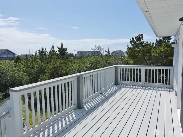 2nd-level: Rear Deck off the 2nd Bedroom w/ stairs leading down the 1st-level Rear Deck and then the Backyard.