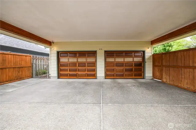 Two-car garage also has an adjoining 2-car carport with convenient alley-access.