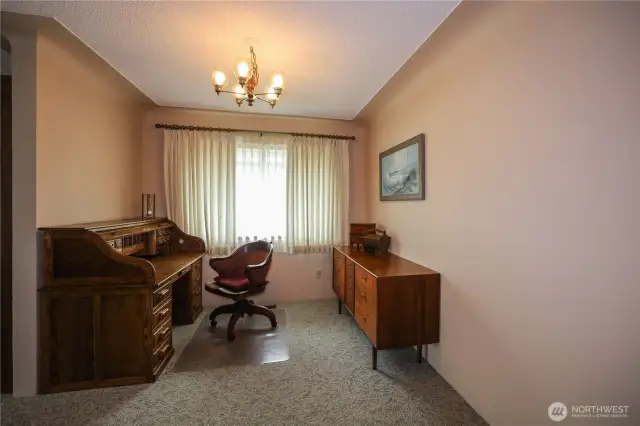 This space off the kitchen can be an office or for a more formal dining area.