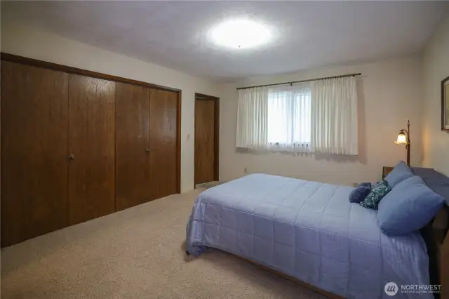 Bedroom with adjacent access to bathroom.