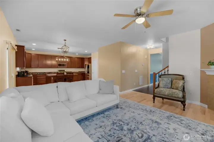 Living room w/ open floorplan connects the kitchen, dining area and living room.